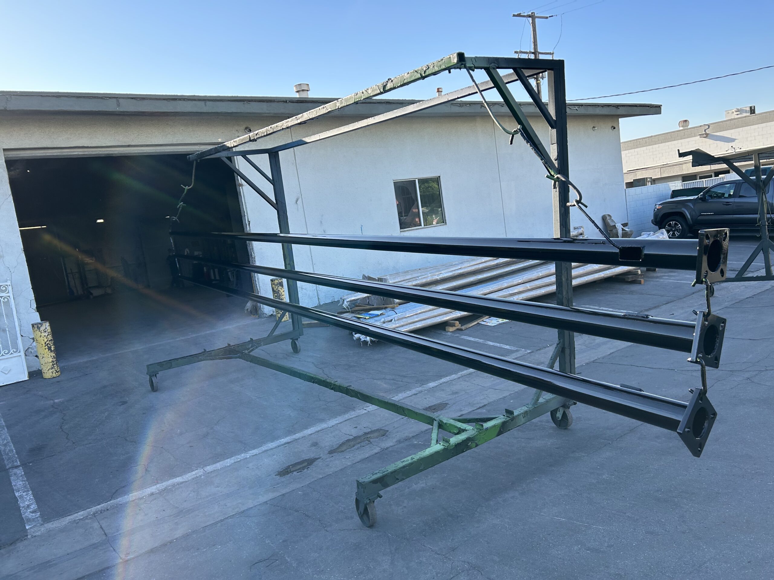 Custom fabricated light pole arm assembly during production