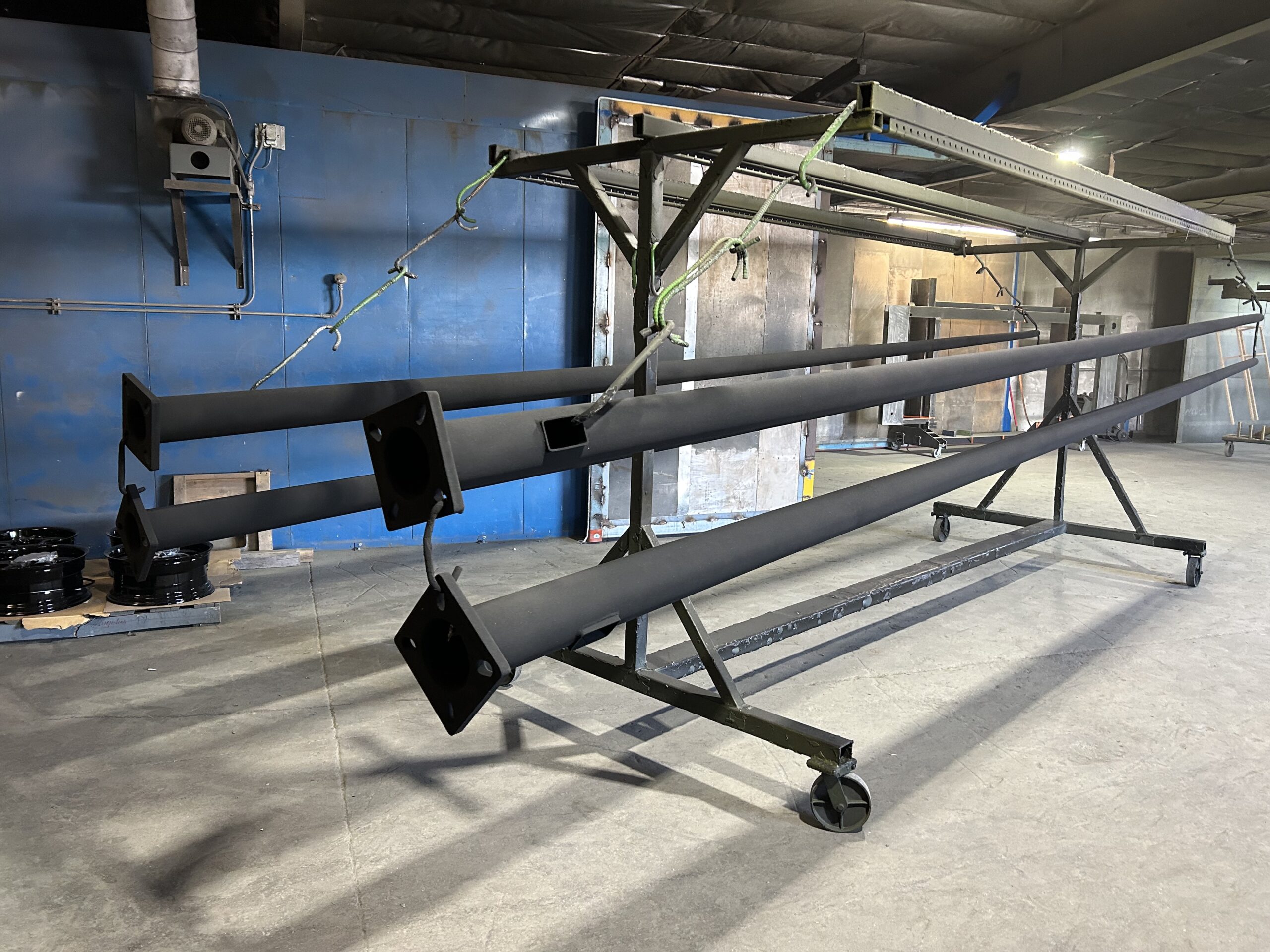 Custom light pole mounting assembly fabricated in the shop