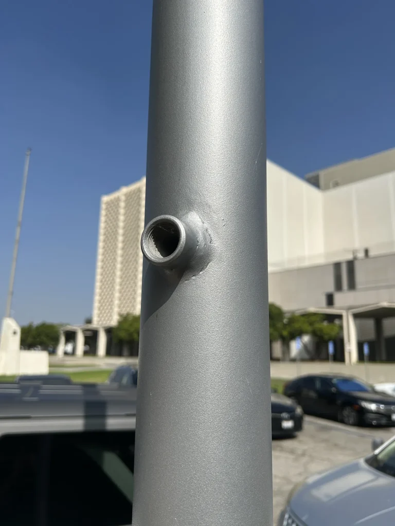 Custom threaded coupling mounting point on a light pole