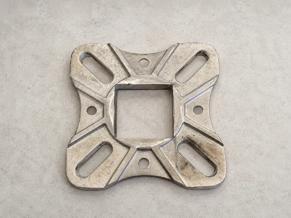 Custom aluminum adapter base plate with slotted mounting holes for light pole replacement