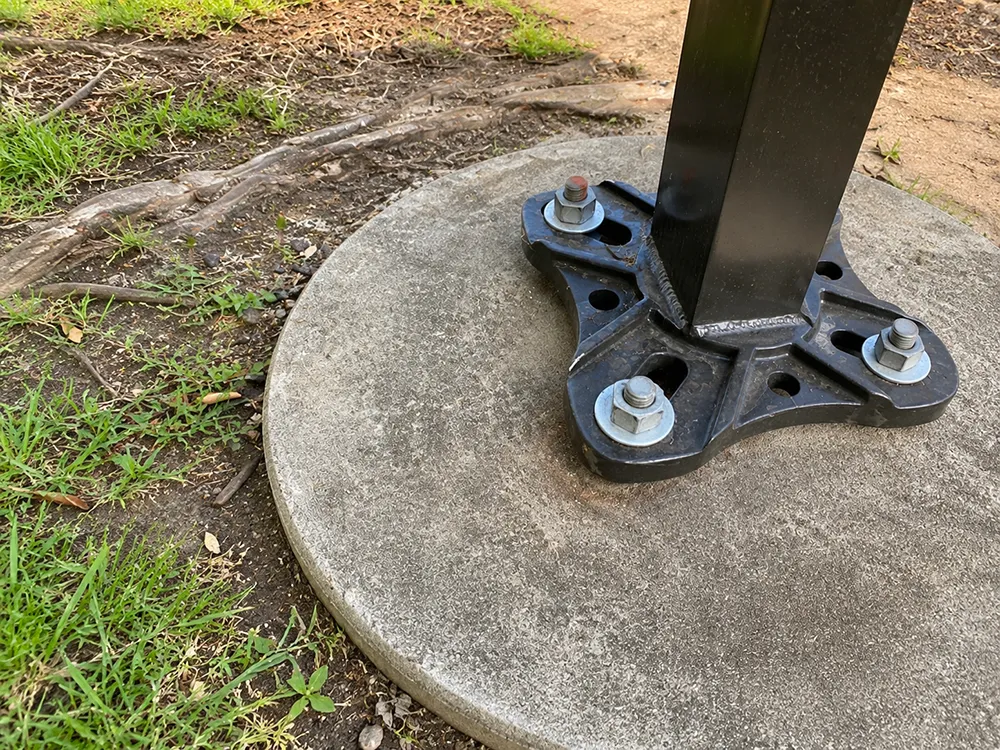 Light pole base with damaged existing anchor bolts and oversized bolt circle